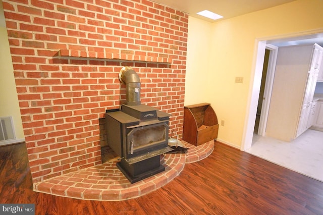 301 Country Club Trl, Fairfield, PA 17320 - detailed view of a wood stove, wood finished floors, and baseboards