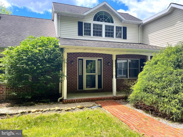 301 Country Club Trl, Fairfield, PA 17320 - view of front of house with covered porch, brick siding, and a shingled roof