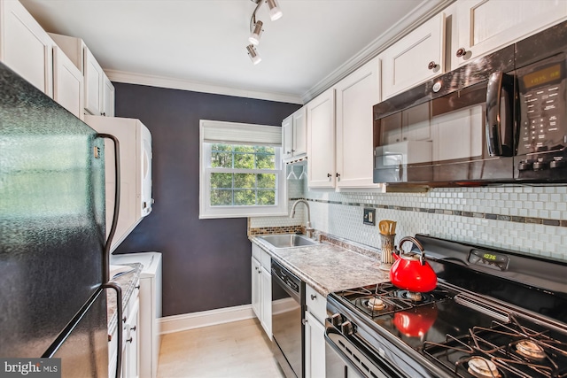 2237 Farrington Ave Unit 301, Alexandria, VA 22303 - kitchen featuring black appliances, a sink, washer and dryer, backsplash, and ornamental molding