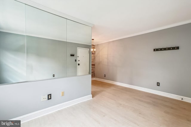 2237 Farrington Ave Unit 301, Alexandria, VA 22303 - unfurnished room with wood finished floors, baseboards, ornamental molding, and a chandelier