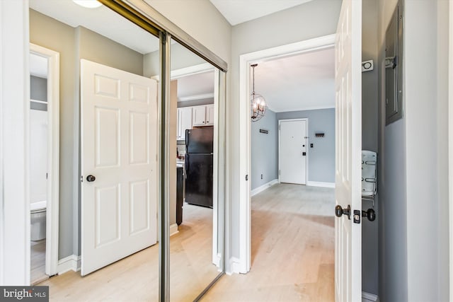 2237 Farrington Ave Unit 301, Alexandria, VA 22303 - hall featuring a chandelier, light wood-style flooring, baseboards, and ornamental molding