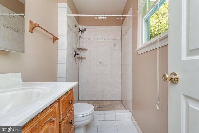 2070 Farragut Dr, Stafford, VA 22554 - bathroom featuring toilet, vanity, tiled shower, and tile patterned floors