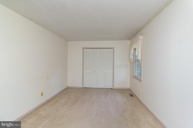 2070 Farragut Dr, Stafford, VA 22554 - unfurnished bedroom featuring light carpet, a closet, and baseboards