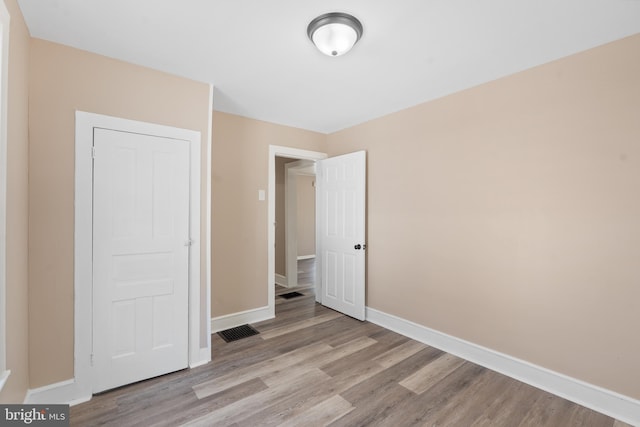 311 W Washington St, Paulsboro, NJ 08066 - unfurnished bedroom featuring wood finished floors and baseboards