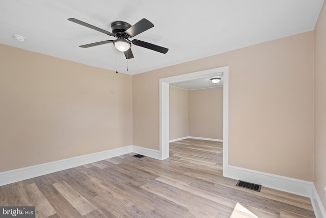 311 W Washington St, Paulsboro, NJ 08066 - empty room featuring wood finished floors, ceiling fan, a smoke detector, and baseboards