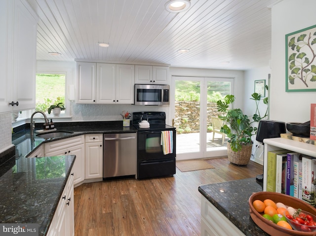 1180 Radnor Hill Rd, Wayne, PA 19087 - kitchen featuring appliances with stainless steel finishes, a sink, plenty of natural light, white cabinetry, and wooden ceiling