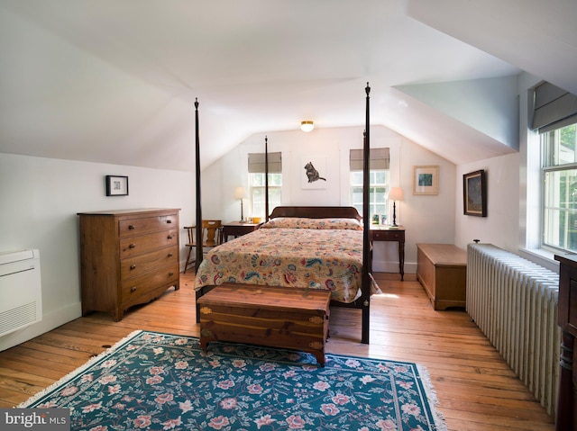 1180 Radnor Hill Rd, Wayne, PA 19087 - bedroom with light wood-style floors, lofted ceiling, and radiator heating unit