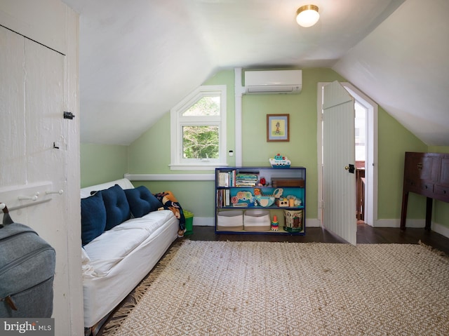 1180 Radnor Hill Rd, Wayne, PA 19087 - additional living space with an AC wall unit, vaulted ceiling, baseboards, and wood finished floors
