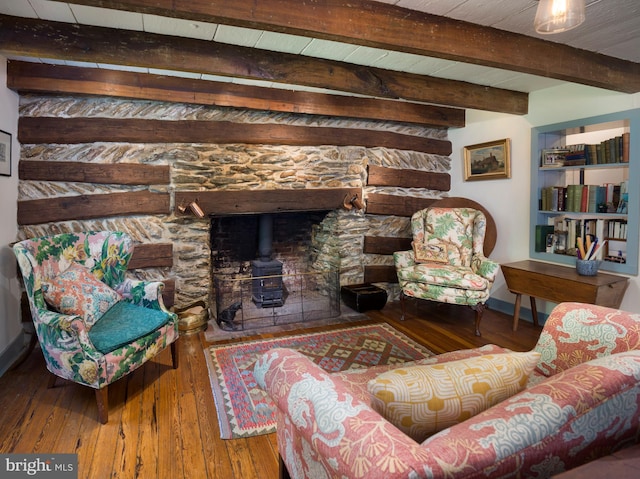 1180 Radnor Hill Rd, Wayne, PA 19087 - living area with a wood stove, hardwood / wood-style floors, beam ceiling, and baseboards
