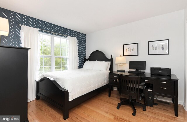 14 Coolidge Way, Princeton, NJ 08540 - bedroom with an accent wall, wood finished floors, wallpapered walls, and an office area