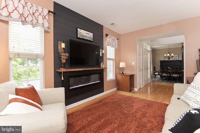 14 Coolidge Way, Princeton, NJ 08540 - living room with a chandelier, wood finished floors, plenty of natural light, and a large fireplace