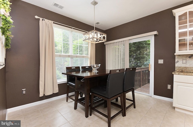 14 Coolidge Way, Princeton, NJ 08540 - dining space featuring a chandelier, baseboards, and light tile patterned floors