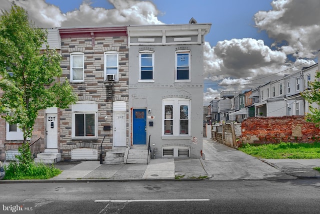 2213 E Madison St, Baltimore, MD 21205 - townhome / multi-family property with entry steps and stone siding