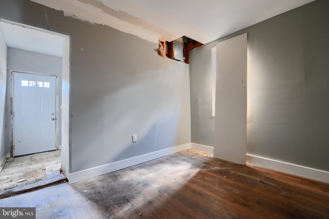 2213 E Madison St, Baltimore, MD 21205 - unfurnished room featuring baseboards and wood finished floors