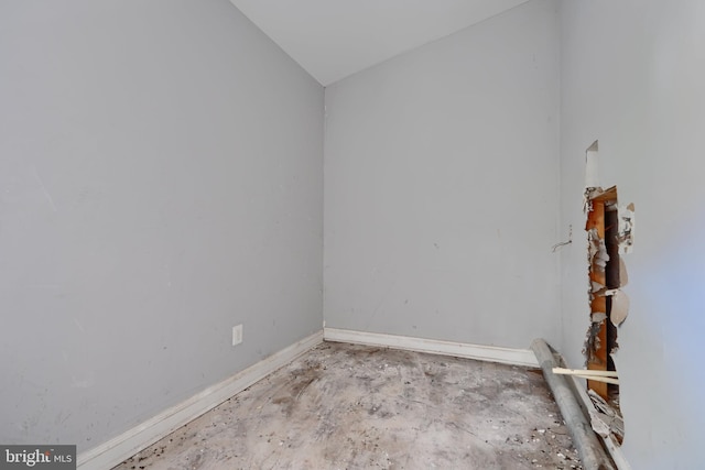 2213 E Madison St, Baltimore, MD 21205 - unfurnished room with baseboards and concrete floors
