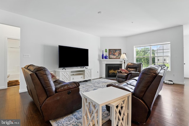 1606 Trotter St, Frederick, MD 21702 - living room with dark wood-style flooring, a fireplace with flush hearth, and baseboards