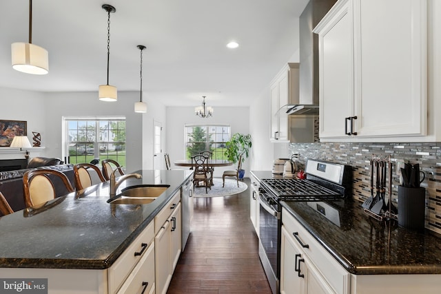 1606 Trotter St, Frederick, MD 21702 - kitchen with stainless steel appliances, a sink, decorative backsplash, dark wood-style floors, and a chandelier