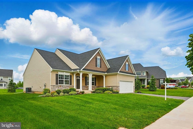 1606 Trotter St, Frederick, MD 21702 - craftsman inspired home with a porch, central AC unit, a front lawn, and stone siding