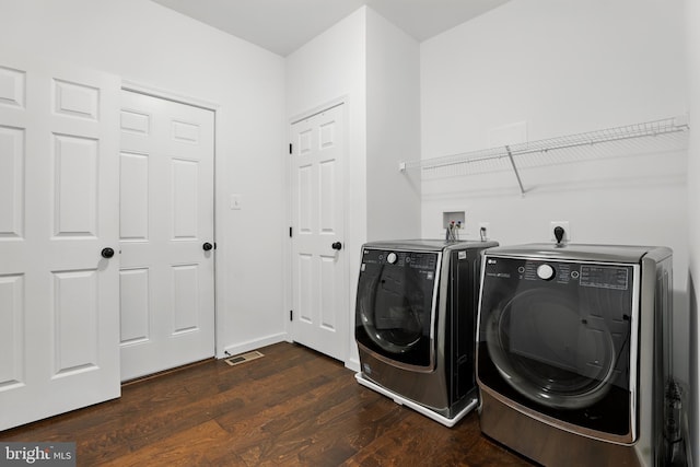 1606 Trotter St, Frederick, MD 21702 - laundry area featuring washing machine and clothes dryer, dark wood-style floors, and baseboards