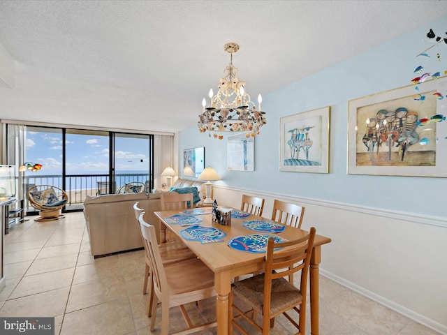 504GEORGETOWNEHOUSERD Georgetowne House Rd Unit 504, Bethany Beach, DE 19970 - dining room with a chandelier, floor to ceiling windows, light tile patterned floors, and baseboards