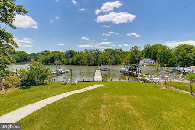 dock featuring a water view and a yard