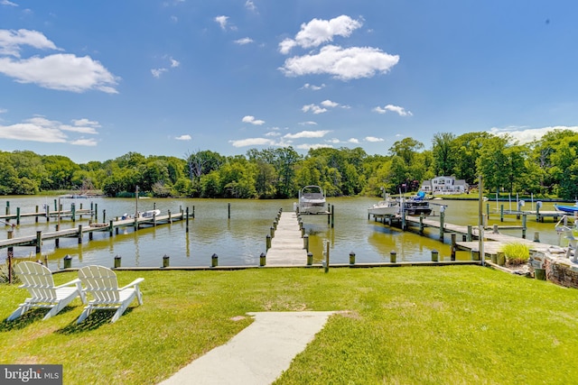 dock area featuring a yard and a water view