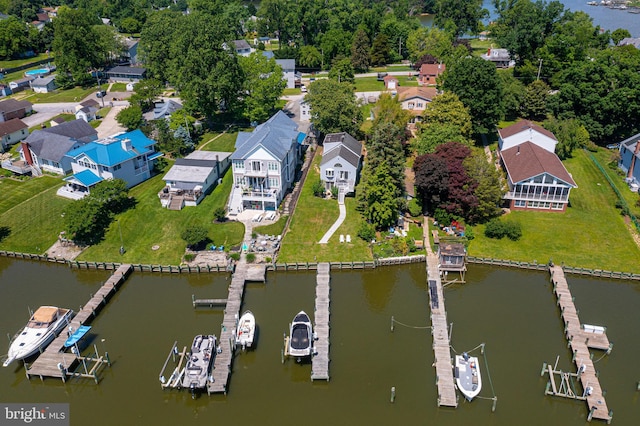 aerial overview of property's location featuring a nearby body of water and nearby suburban area