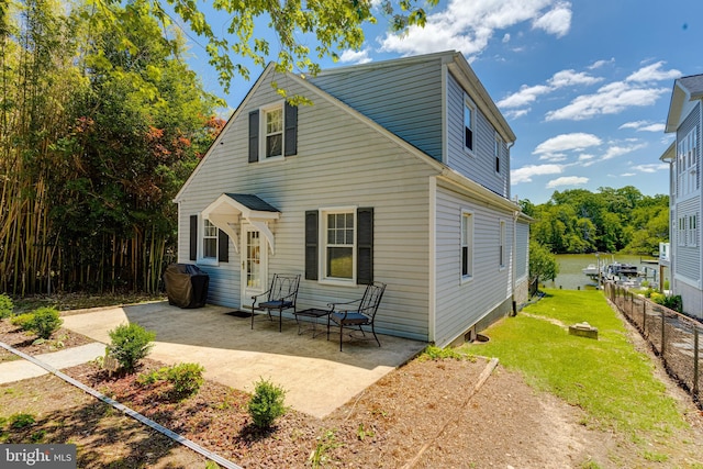 rear view of house with a patio