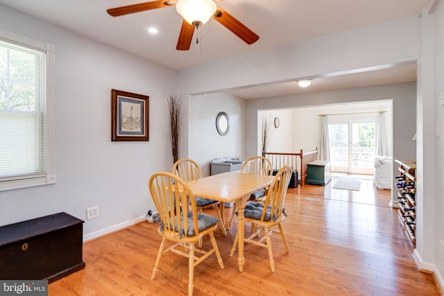 dining room with light wood-style flooring, ceiling fan, baseboards, and recessed lighting