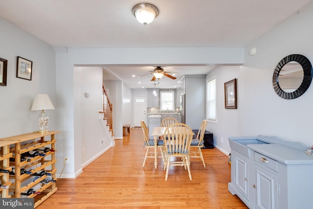 dining space featuring stairway, light wood-style flooring, ceiling fan, baseboards, and recessed lighting