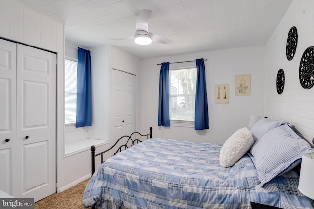 bedroom with carpet floors and a ceiling fan