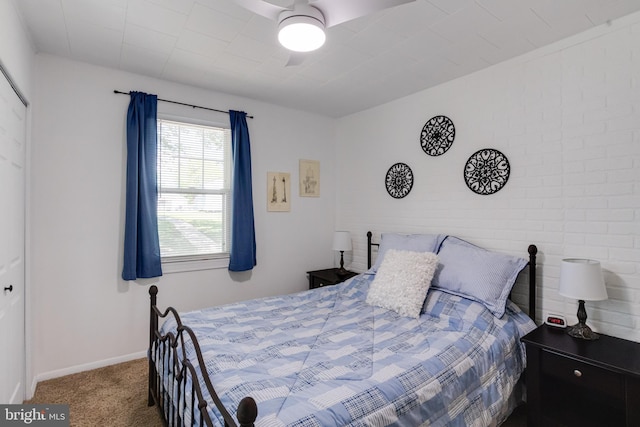 carpeted bedroom with baseboards