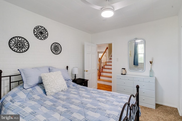 bedroom with carpet flooring and baseboards