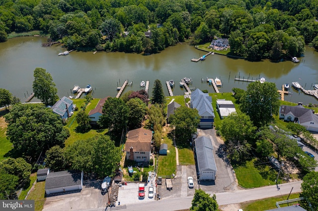 aerial view of residential area featuring a large body of water