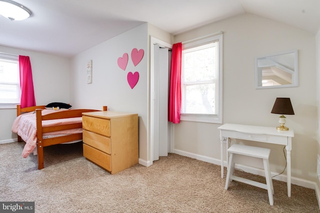 bedroom with light carpet, multiple windows, and lofted ceiling