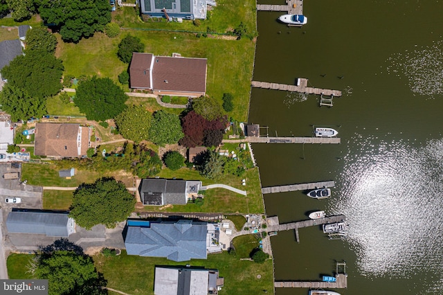 aerial view of property's location with a nearby body of water