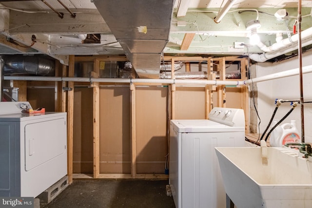laundry area featuring washing machine and clothes dryer
