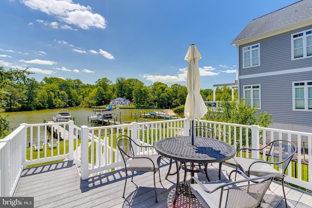 wooden terrace featuring a water view