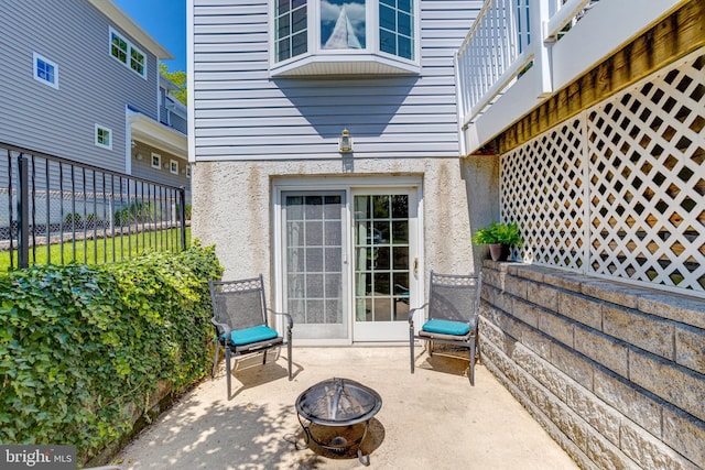 view of patio with a fire pit