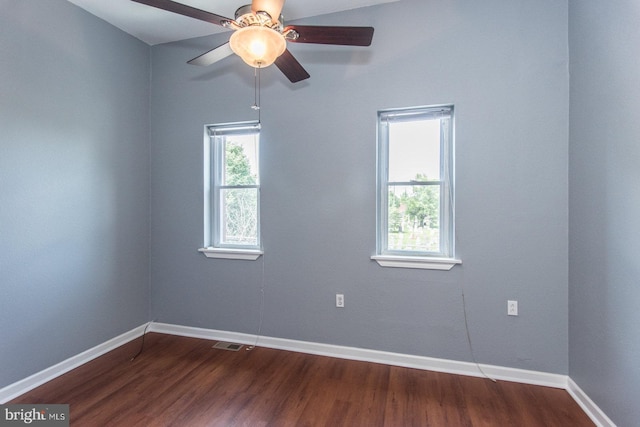 3539 Almond St, Philadelphia, PA 19134 - spare room with dark wood-style floors, baseboards, and a ceiling fan