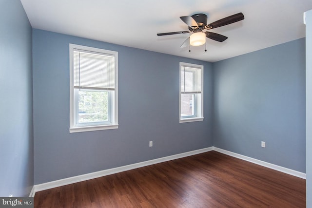 3539 Almond St, Philadelphia, PA 19134 - empty room featuring plenty of natural light, dark wood-style flooring, baseboards, and ceiling fan