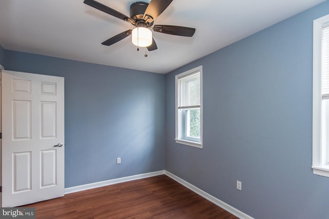 3539 Almond St, Philadelphia, PA 19134 - spare room with baseboards, dark wood-style flooring, and a ceiling fan