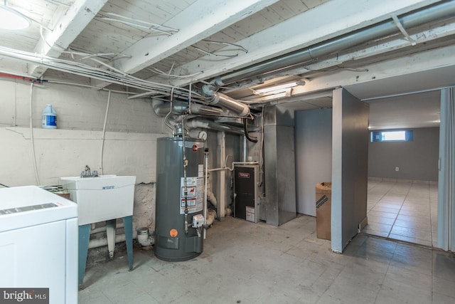 3539 Almond St, Philadelphia, PA 19134 - below grade area featuring water heater, washer / dryer, a sink, and heating unit