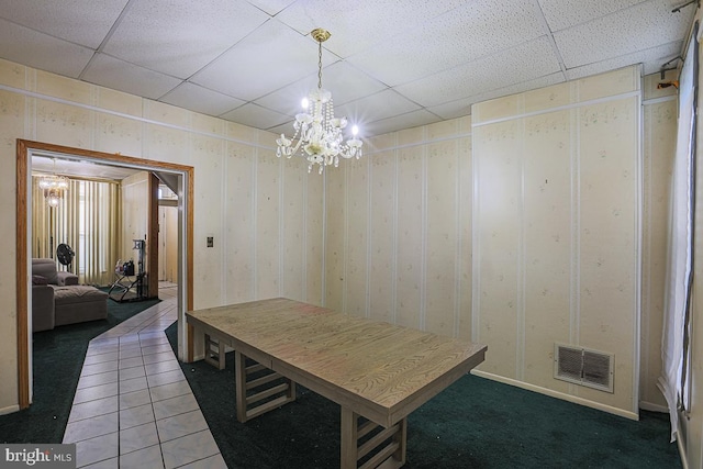 1721 Ruxton Ave, Baltimore, MD 21216 - dining space featuring a paneled ceiling, a chandelier, and carpet floors