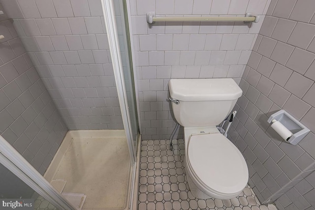 1721 Ruxton Ave, Baltimore, MD 21216 - bathroom with toilet, tile walls, a shower stall, and tile patterned flooring