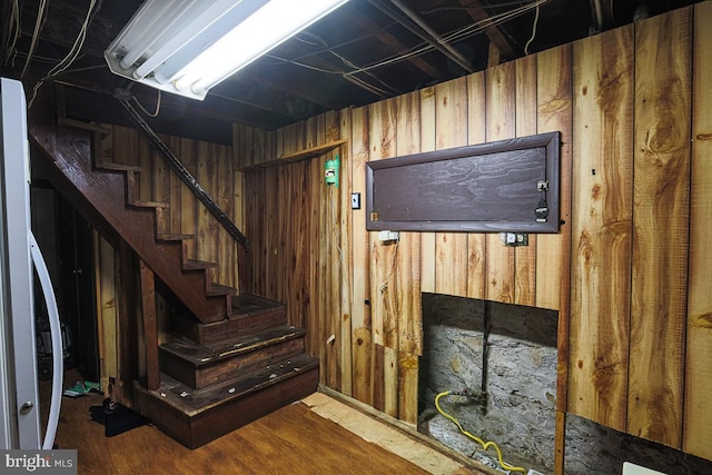1721 Ruxton Ave, Baltimore, MD 21216 - below grade area featuring wood walls, stairs, and wood finished floors