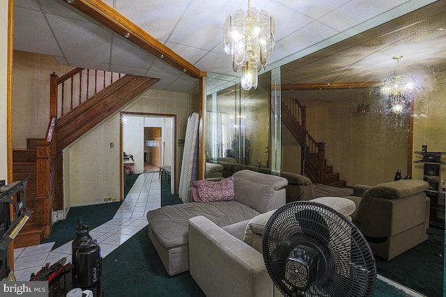 1721 Ruxton Ave, Baltimore, MD 21216 - living room featuring stairs, a chandelier, and wood walls