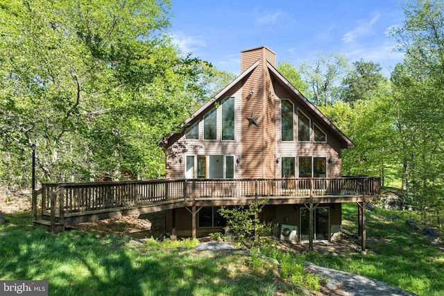 2107 Lenape Ter, Canadensis, PA 18325 - rear view of property with a deck, a chimney, and a lawn