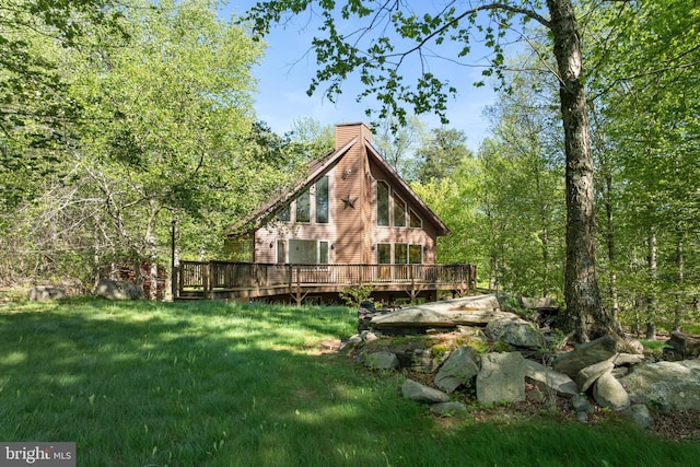 2107 Lenape Ter, Canadensis, PA 18325 - view of side of home with a chimney, a yard, and a deck