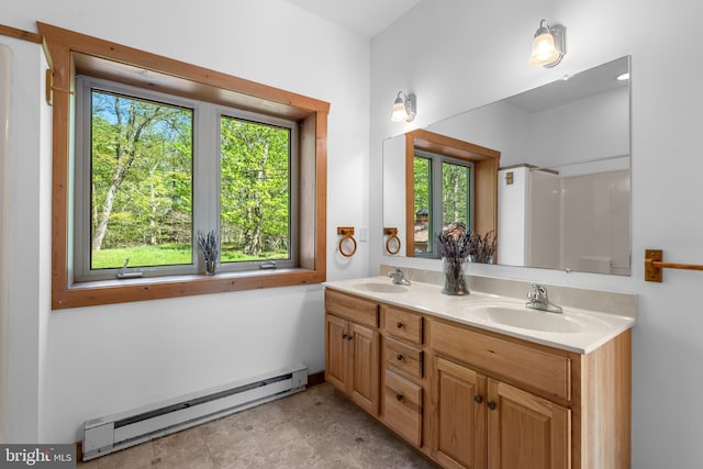 2107 Lenape Ter, Canadensis, PA 18325 - bathroom with a baseboard heating unit, double vanity, and a shower